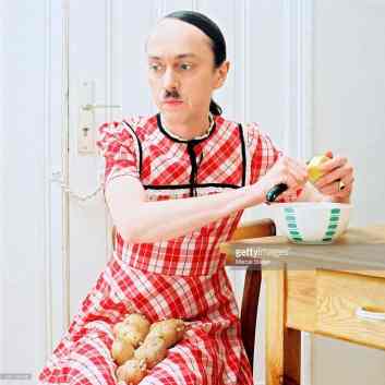 hitler-in-girl-outfit-peeling-potatoes-weird-stock-photos